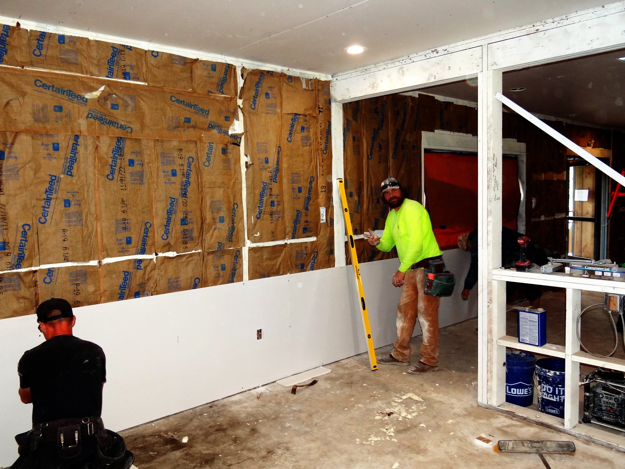 Hanging drywall over new insulation
