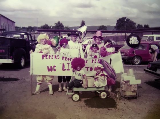 Kids in costumes with a Peper's banner at a parade