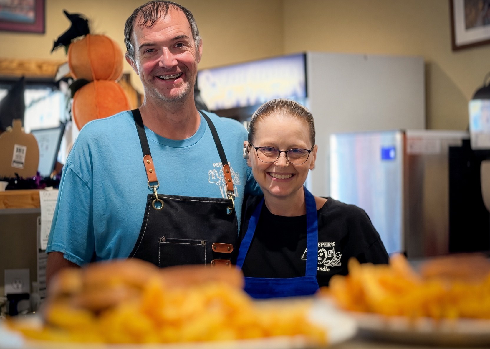 Matt and Mandie smiling behind the counter